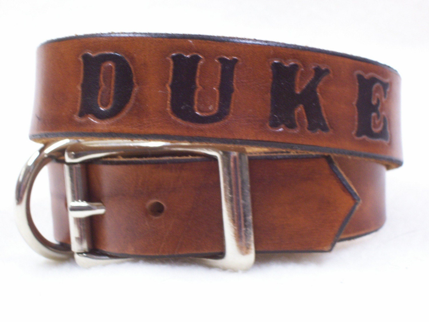 Personalized leather dog collar with hand-stamped name, timber brown with black lettering